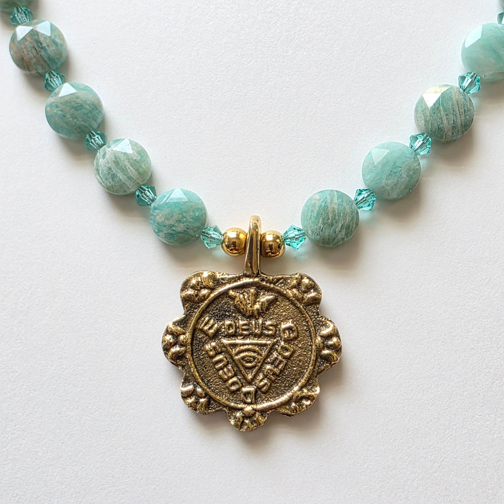Necklace with amazonite beads and a gold clasp on a white background