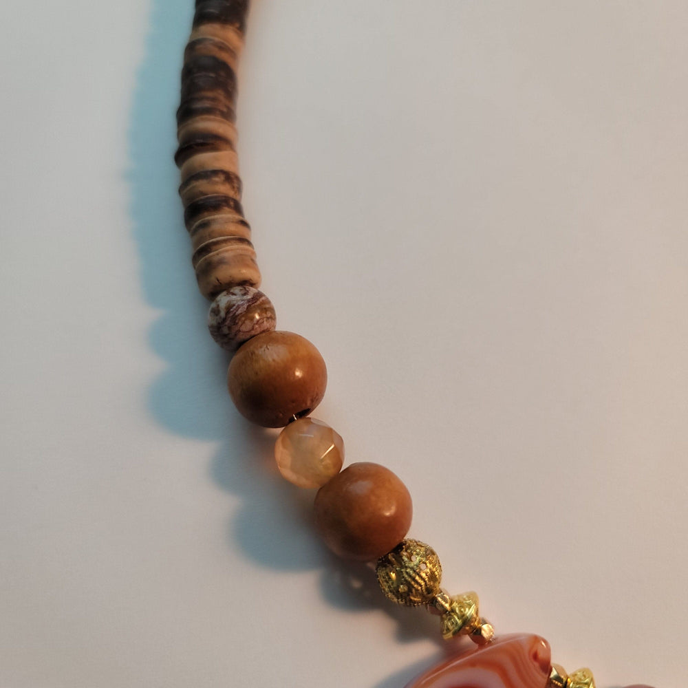 
                  
                    "Babaylan" Boar's Tusk Pendant with Red Agate and Wood Elements Necklace Herbalaria 
                  
                