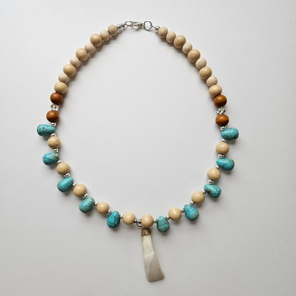 
                  
                    "Lupa at Tubig" Earth and Water Carabao Tooth Pendant and Turquoise Howlite Necklace Accessories Herbalaria 
                  
                