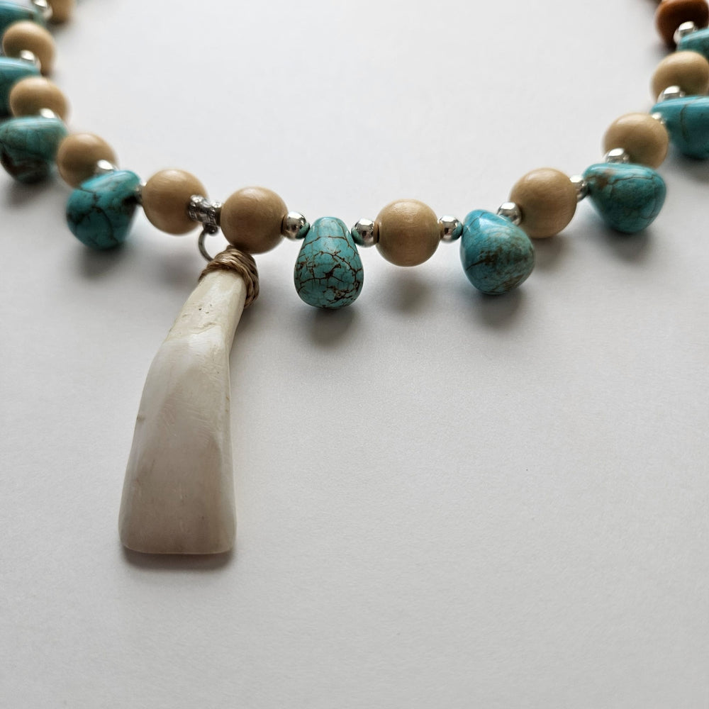 
                  
                    "Lupa at Tubig" Earth and Water Carabao Tooth Pendant and Turquoise Howlite Necklace Accessories Herbalaria 
                  
                