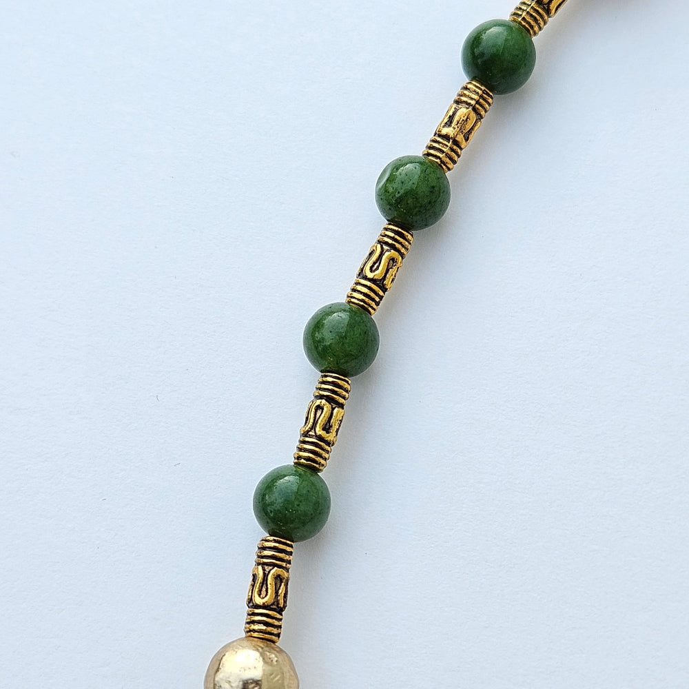 
                  
                    Maw sit sit Burmese jade beads and gold colored metal tubes
                  
                